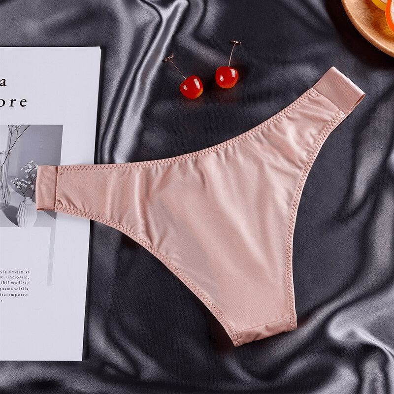 Elegant blush pink elastic waist panty for women on satin fabric, offering sleek comfort and flexibility for fitness activities.